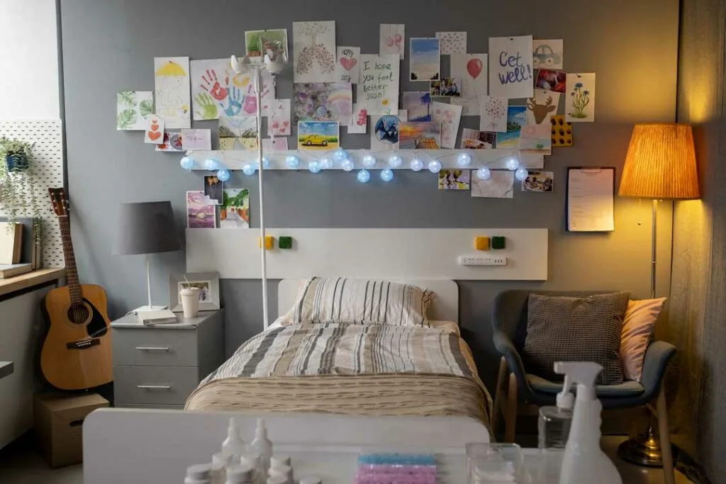 Memory wall in student housing decorated with photos and personal memorabilia