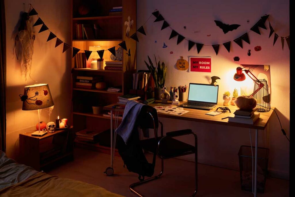 Student dorm room with soft, layered lighting from string lights and lamps