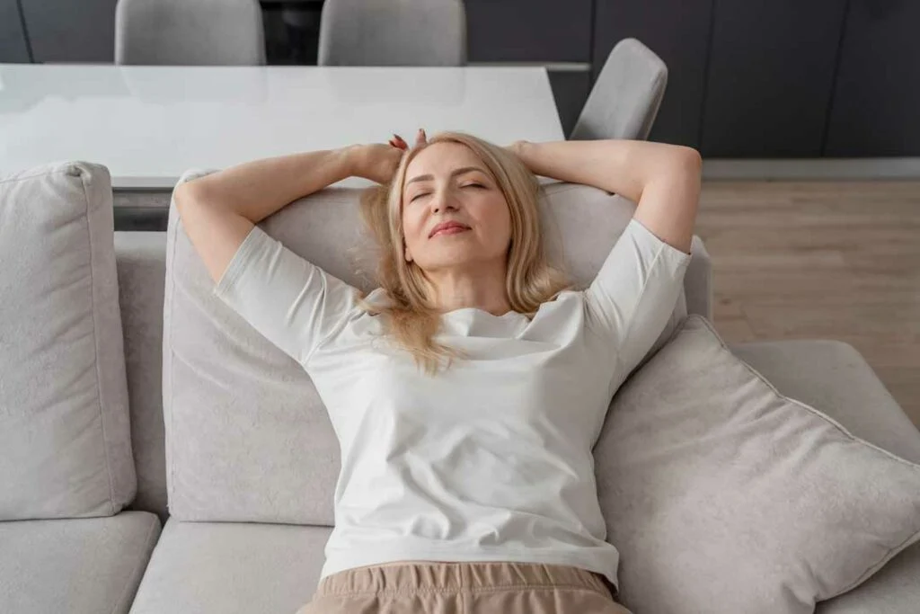 Parent resting with heat therapy for back pain relief