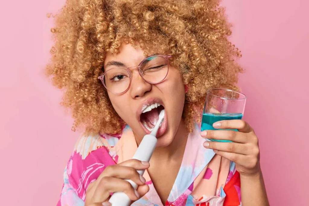 Person brushing teeth