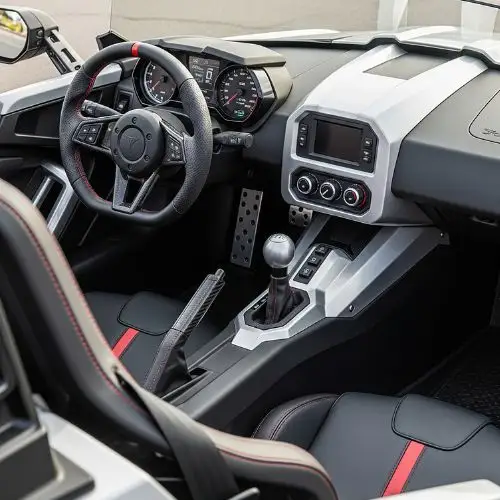 Polaris Slingshot cockpit with bucket seats and minimal dash.